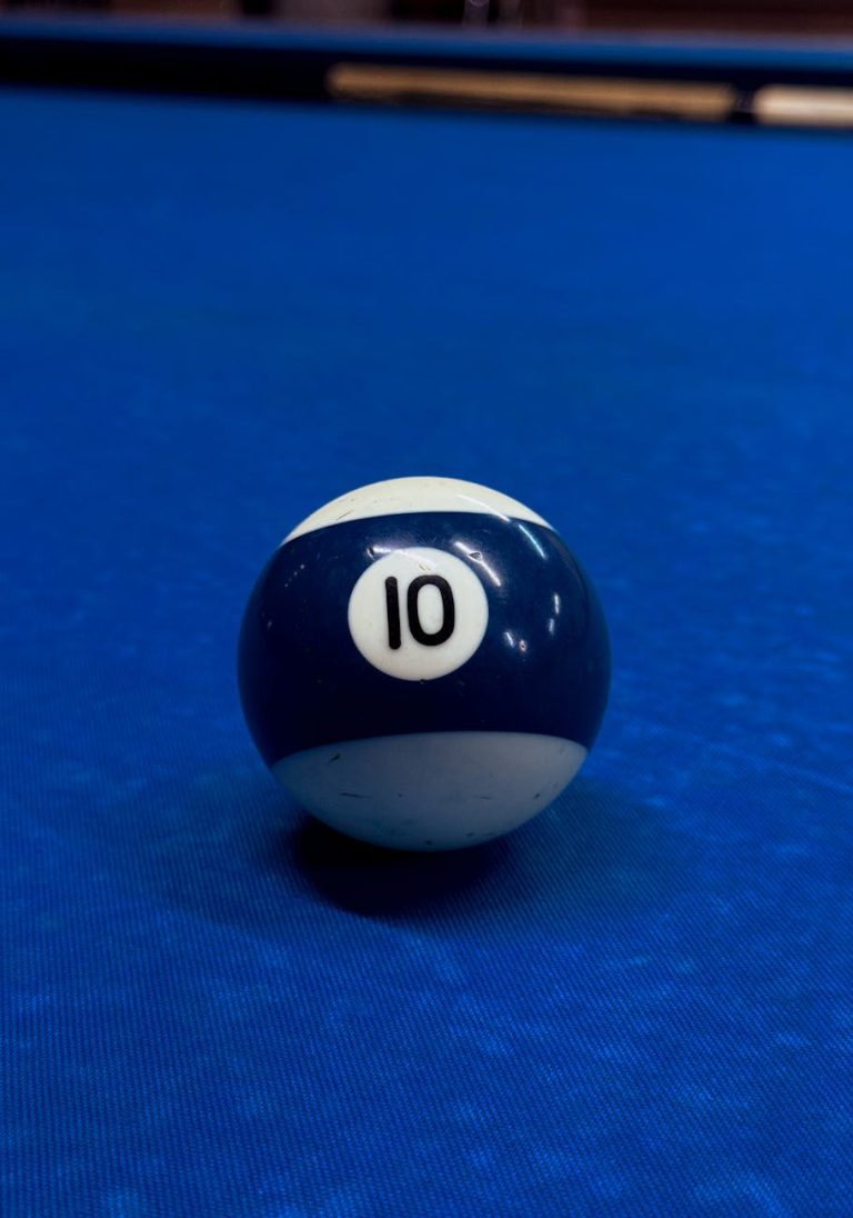 Close-up of a blue 10 ball on a billiards table, highlighting game focus.