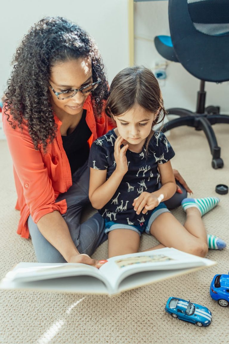 A loving mother and daughter enjoy a bonding time reading a book at home.